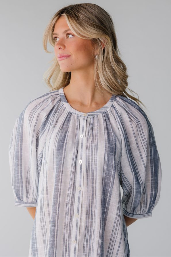 Closeviewofwhiteandbluestripebuttondowndress