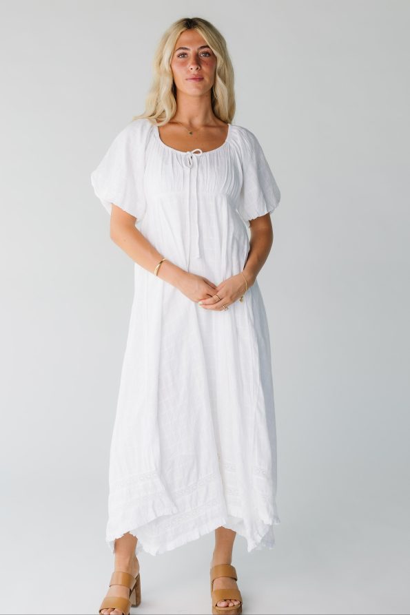 Modest_women_s_white_midi_dress_with_scoop_neckline_and_short_sleeves